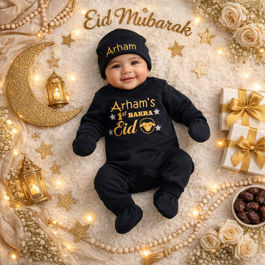Baby wearing a black outfit with 'Eid Mubarak' text, surrounded by festive decorations.