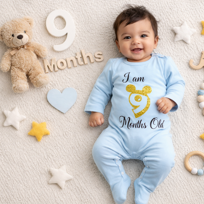 Baby in a blue onesie celebrating 9 months with toys and decorations on a beige background