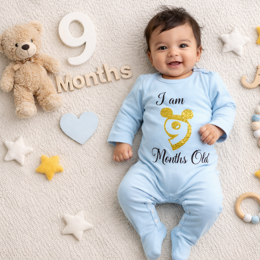 Baby in a blue onesie celebrating 9 months with toys and decorations on a beige background