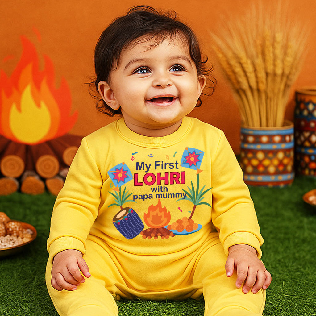 Child wearing a yellow 'My First Lohri' onesie sitting on grass with colorful decorations in the background.
