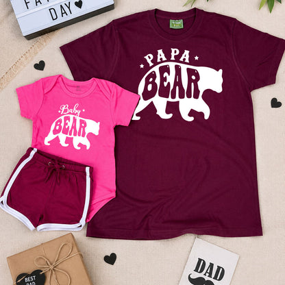 Father's Day themed t-shirt and baby onesie with 'Papa Bear' and 'Baby Bear' designs, surrounded by decorative items.