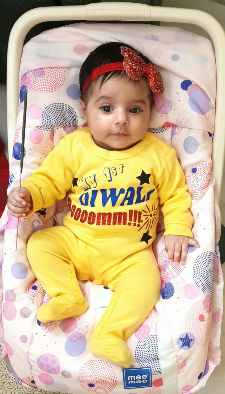"Custom baby jumpsuit with name and Diwali design for  photo shoots."
