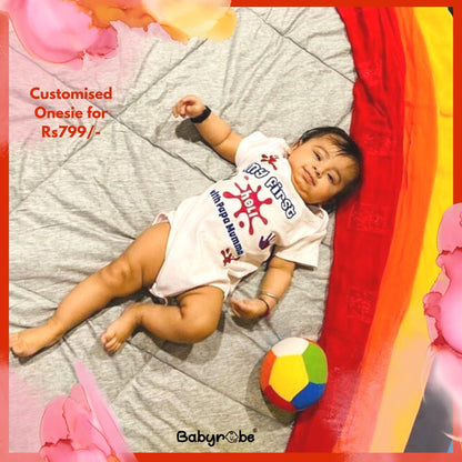 "Celebrate My First Holi with a personalized baby onesie."